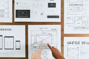 hands showing web design outline
